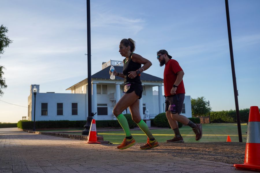 Runner coming through the crew camp at sunrise